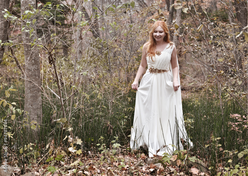 Beautiful fairy lady walking in the forest.