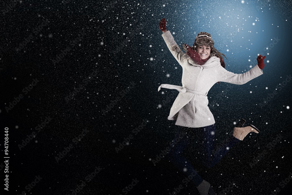 Composite image of happy blonde in winter clothes posing Composite image of happy blonde in winter clothes posing