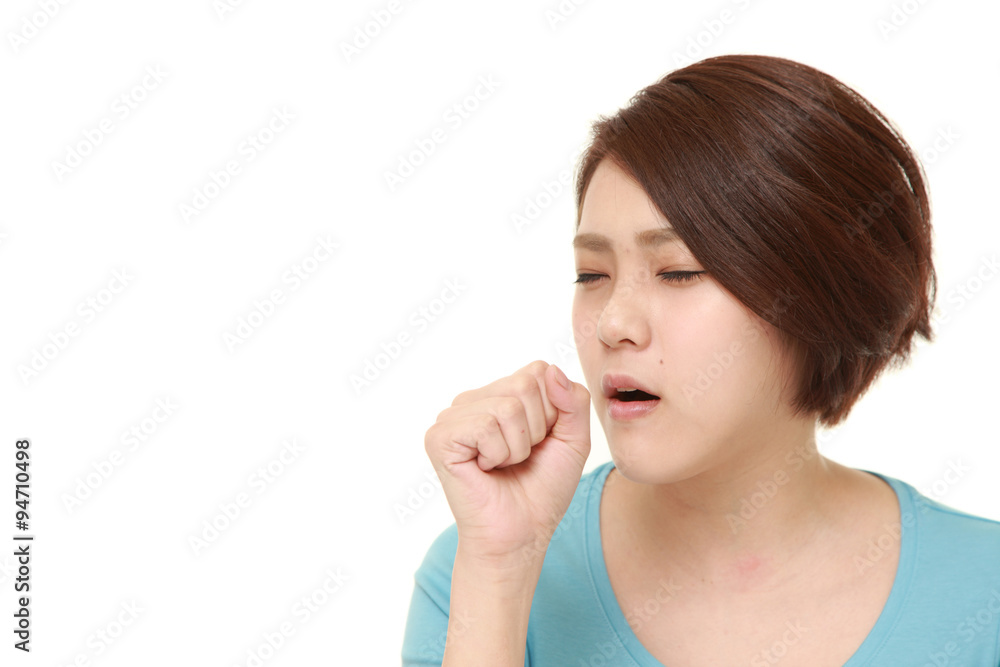 young Japanese businesswoman coughing young Japanese businesswoman coughing