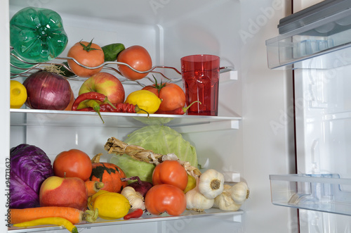 Fruits  vegetables and water in refrigerator