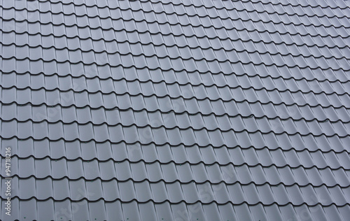 Part of a tiled roof of metal.
