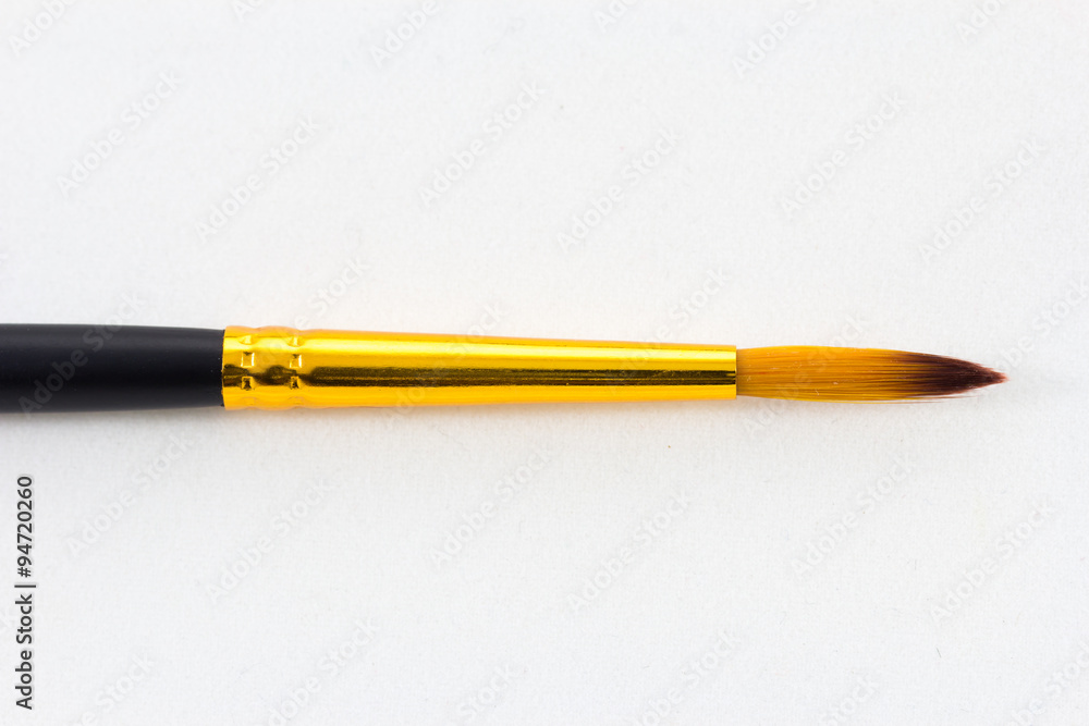 paintbrush on white paper background paintbrush on white paper background