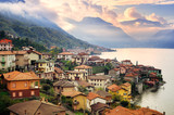 View of Como Lake, Milan, Italy, on sunset with Alps mountains i