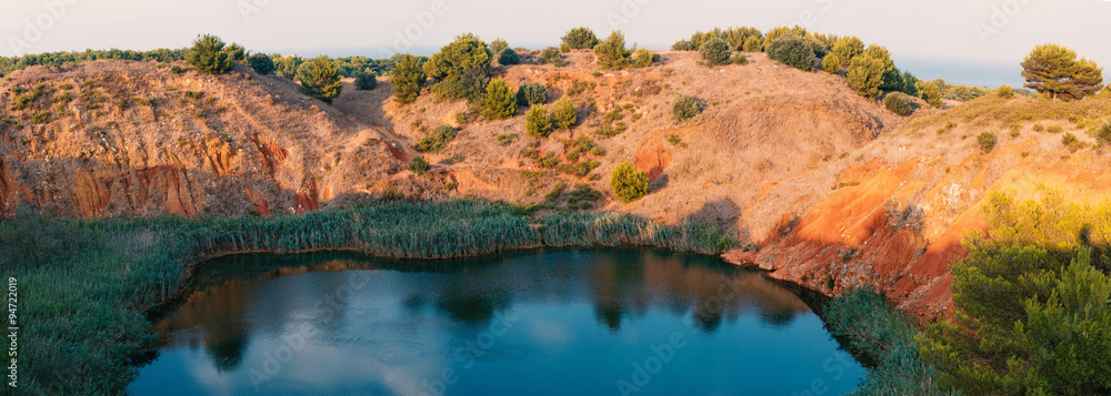 Bauxite Mine with Lake at Otranto. Apulia, Italy. Panoramic image