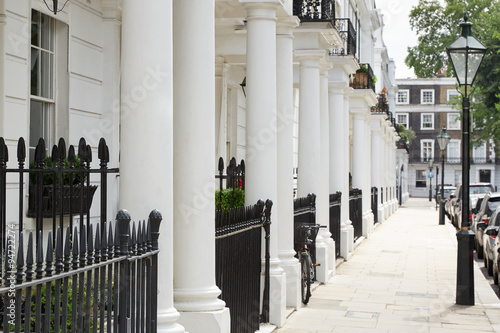Row of beautiful white edwardian houses in Kensington, London
