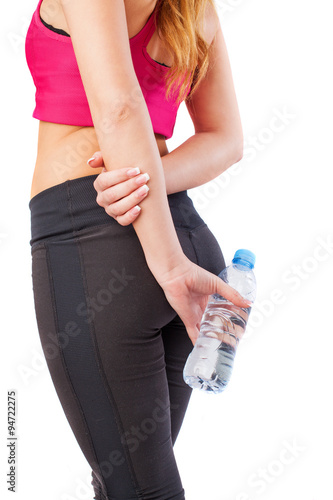 pretty young sporty girl holding a water bottle
