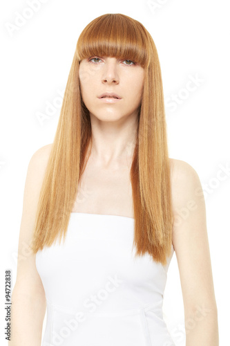 Young woman with blond, long, straight hair on white