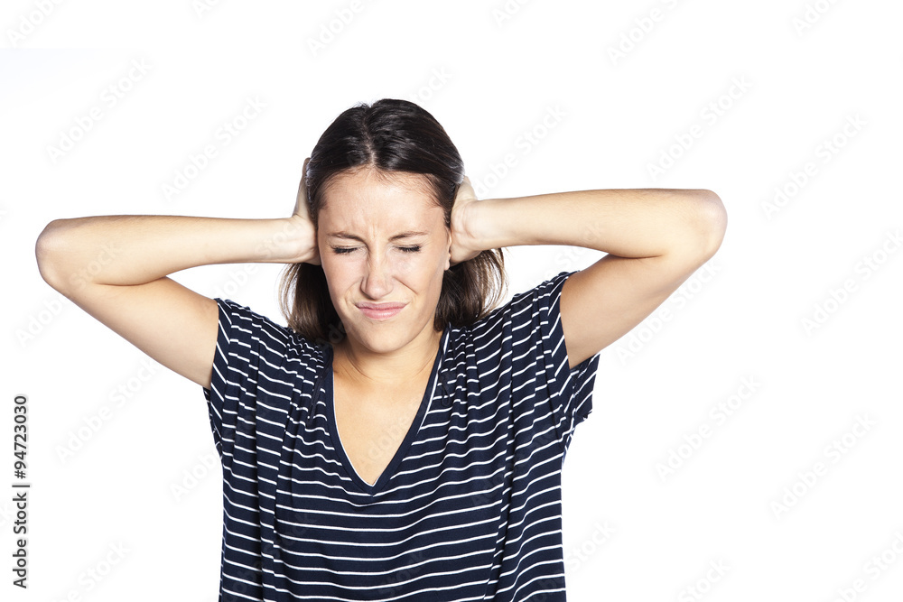 Young beautiful woman covering her ears with her hands, isolated on a white background Young beautiful woman covering her ears with her hands, isolated on a white background