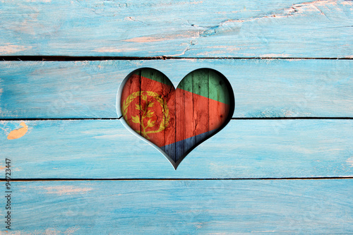 Love Eritrea. Heart and flag on a blue wooden board photo