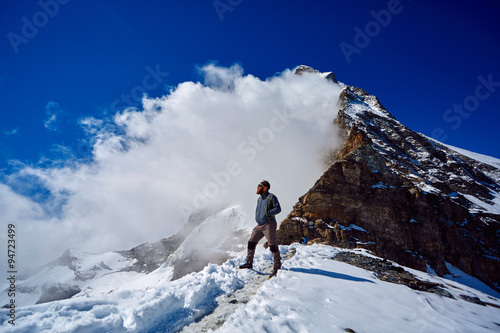 hiker at the top of a pass © vitaliymateha