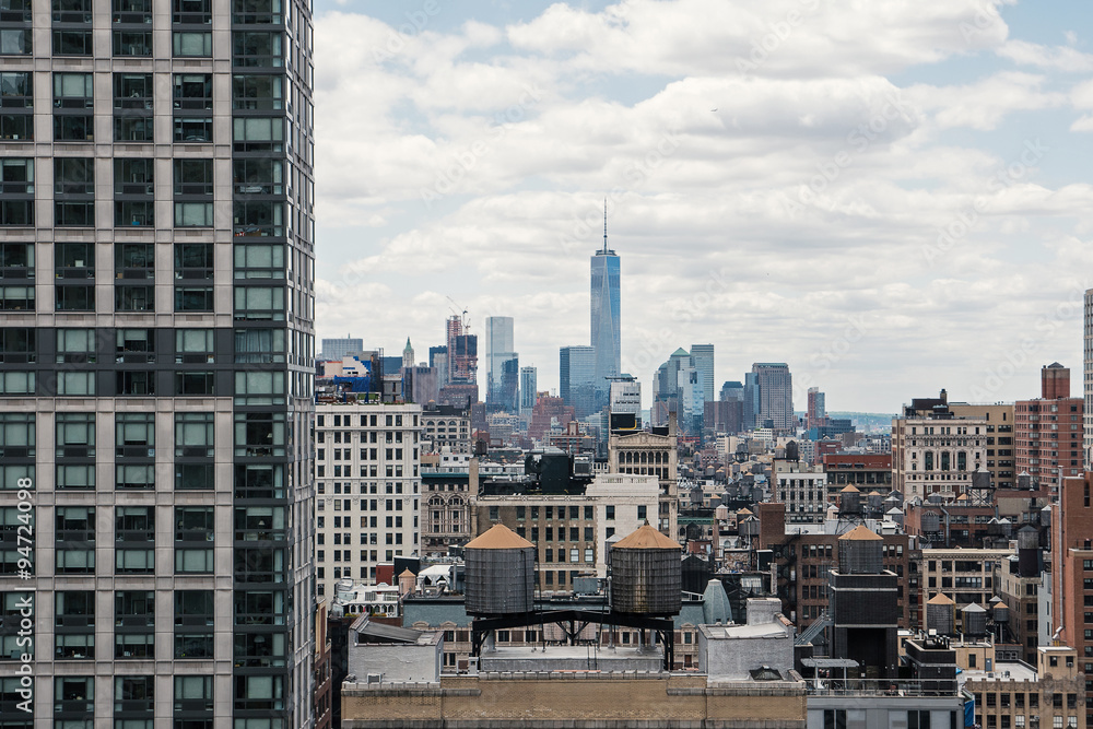 Fototapeta premium New York City Manhattan skyline with cloudy sky.