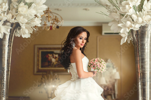 Bride in white wedding dress in luxury place