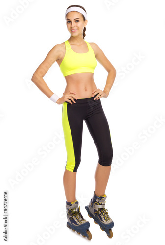 Young sporty woman on roller skates isolated