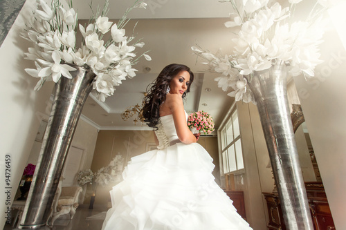 Bride in white wedding dress in luxury place