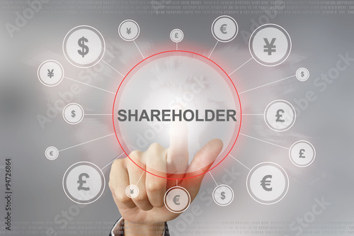 Photos business hand pushing shareholder button