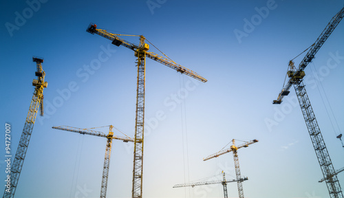 Lot of working building cranes