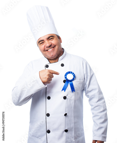 portrait of a cook man wearing an isignia photo