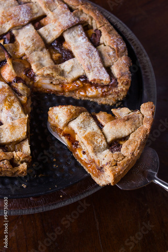 Apple pear pie in a baking pan  with ingredients.