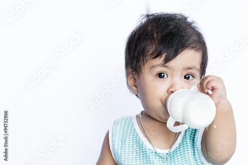 Asian baby drinking milk from Baby bottle