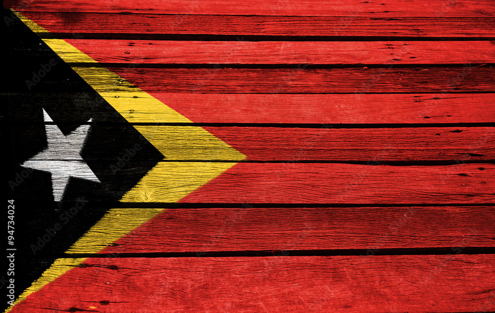Naklejka premium East Timor flag on wood