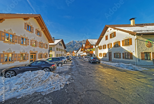 Snowy street with impressive facades of the houses in Garmisch-Partenkirchen