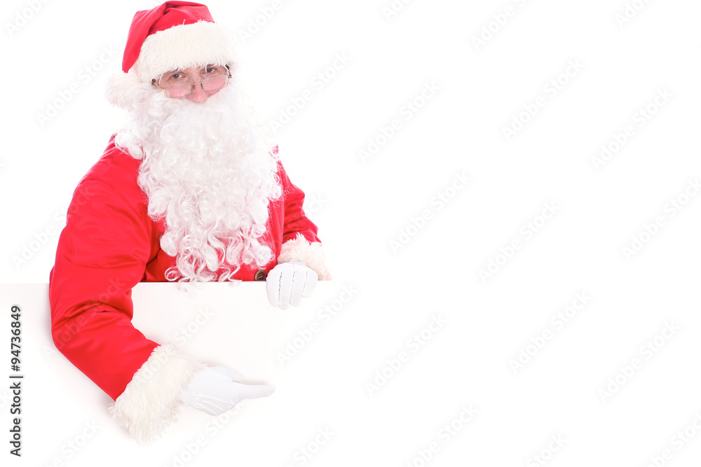 Kind Santa Claus pointing in white blank sign, isolated on white background Kind Santa Claus pointing in white blank sign, isolated on white background