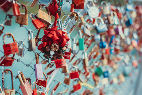 Colourful love padlocks on a bridge over Salzach River in Salzburg, Austria.