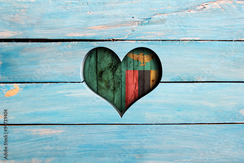 Love Zambia. Heart and flag on a blue wooden board photo