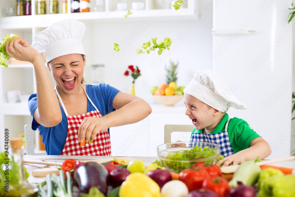 Mother and son have fun in kitchen food war Mother and son have fun in kitchen food war