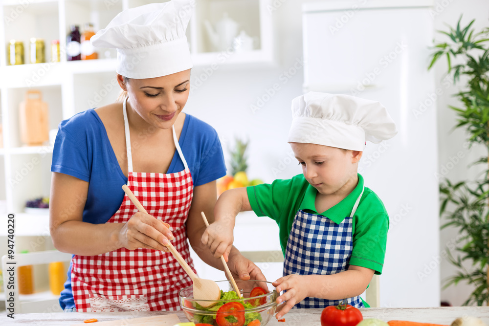 Family prepare lettuce for meal Family prepare lettuce for meal