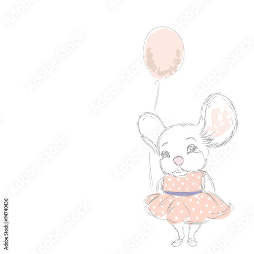 Cute little mouse in a pink dress with polka dots .
