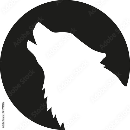 Wolf head howling in front of the moon