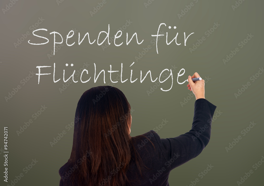 Donations / Woman writes the german words Donations for Refugees Donations / Woman writes the german words Donations for Refugees
