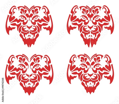 Fototapeta Naklejka Na Ścianę i Meble -  Flaming tribal tiger mask. Four tiger head roar isolated on a white background