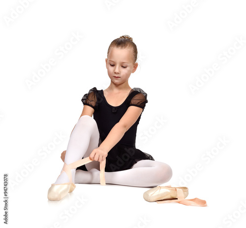 ballerina wears ballet shoes