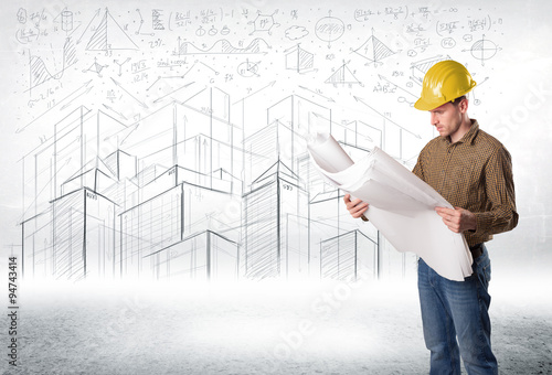 Handsome construction specialist with city drawing in background © ra2 studio