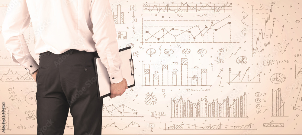 Businessman with diagrams and graphs Businessman with diagrams and graphs