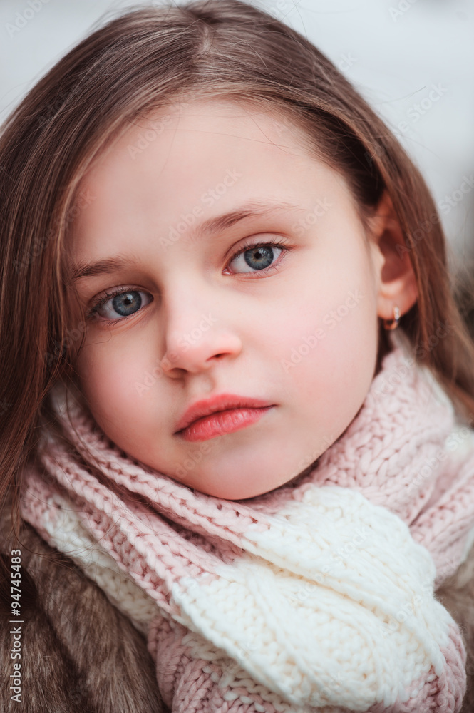 close up outdoor portrait of dreamy child girl in cozy scarf close up outdoor portrait of dreamy child girl in cozy scarf