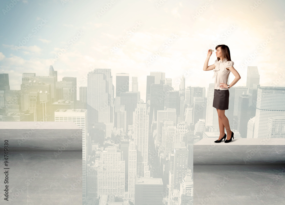 Businesswoman standing on the edge of rooftop Businesswoman standing on the edge of rooftop