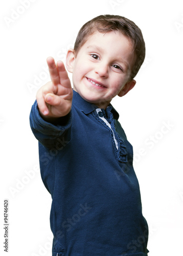 little kid doing victory sign