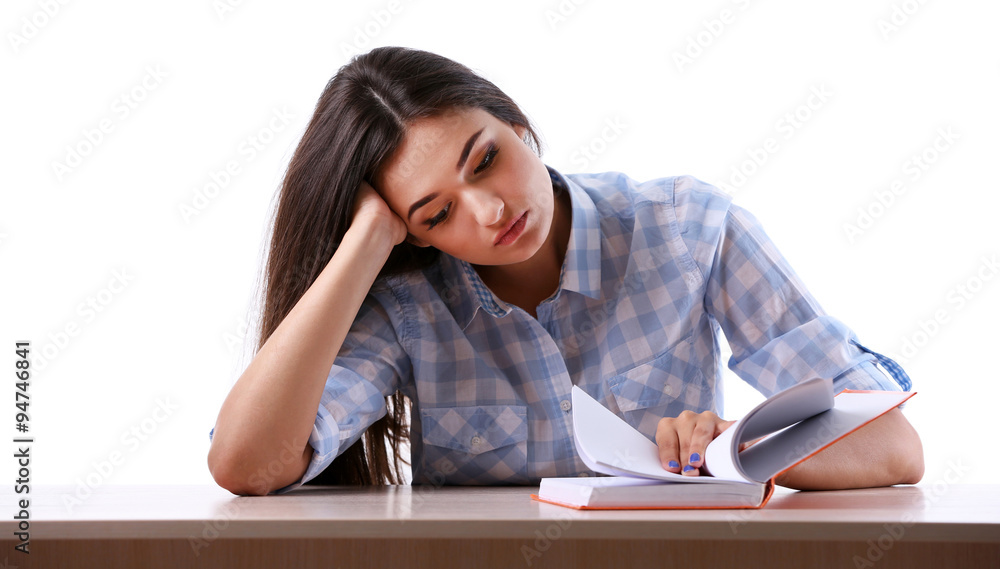 Young girl reading book isolated on white Young girl reading book isolated on white