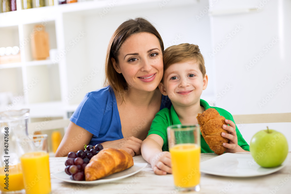 Happy smiling family eating healthy fresh breakfast