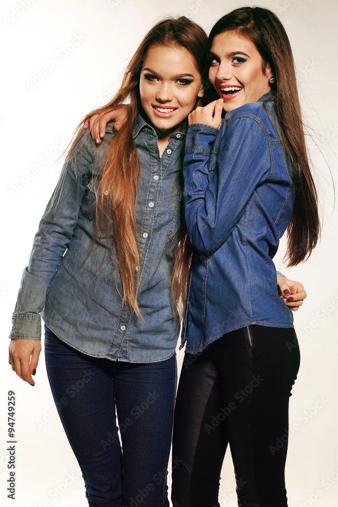 women with long hair and bright makeup wears casual clothes