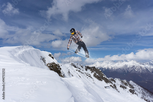 Flying snowboarder on mountains, extreme sport © Vasily Merkushev