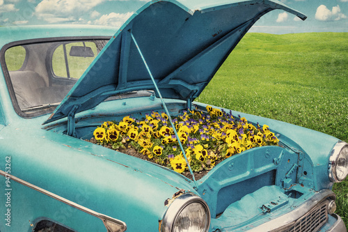 Blue car with flowers.
