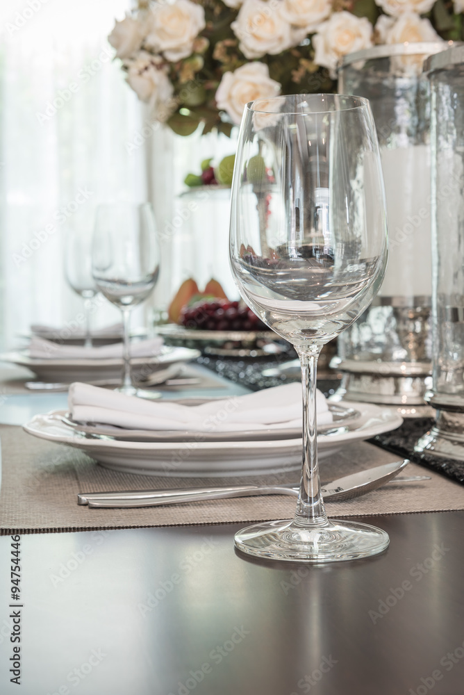 empty wine glass on wooden dinning table with table set empty wine glass on wooden dinning table with table set