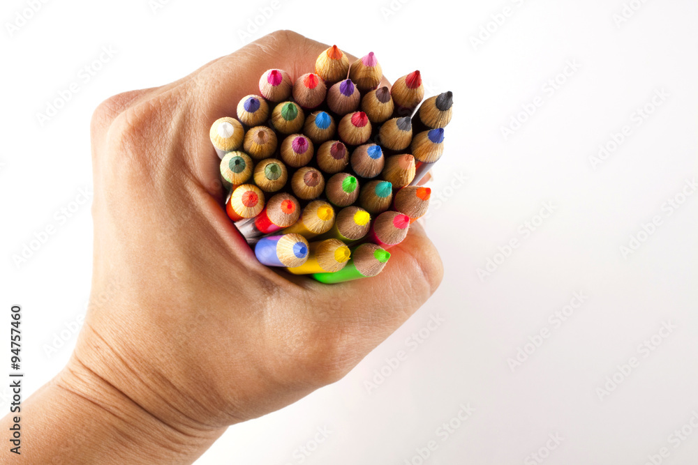 coloring pencils bunch in a hand shot on a white background top view coloring pencils bunch in a hand shot on a white background top view