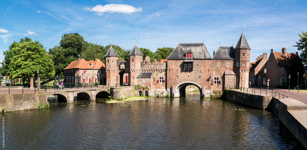 Medieval fortress city wall gate Koppelpoort and Eem River in the city of Amersfoort, Netherlands