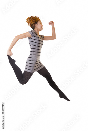 Skinny Asian American Woman Jumping In Knit Dress