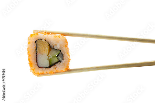 Sushi maki in chopsticks isolated on white background
